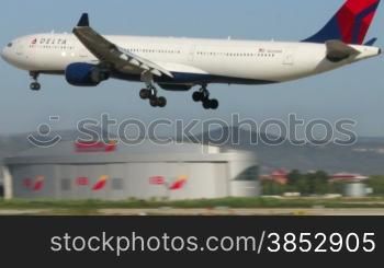 Delta Airlines passenger jet.Commercial airplane Landing. Aircraft landing at Barcelona Airport.Passenger airplane landing.Flying airplane approaching airstrip.