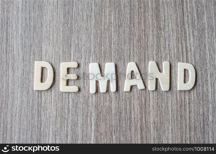 DEMAND word of wooden alphabet letters. Business and Idea concept