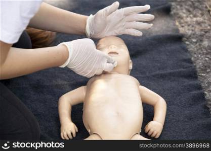 Demonstrating CPR on a infant dummy