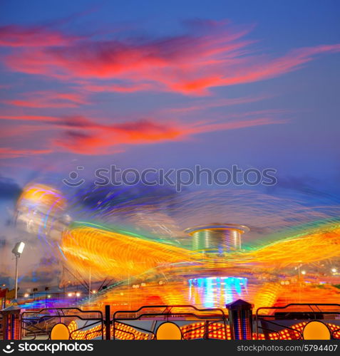 Denia in Alicante sunset with fairground fair at Spain