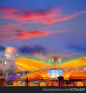 Denia in Alicante sunset with fairground fair at Spain