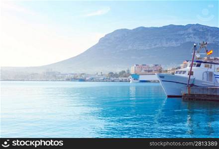 Denia mediterranean port village with Mongo mountain and blue sea water