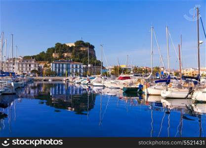 Denia Port with castle hill and marina boats in Alicante province Spain