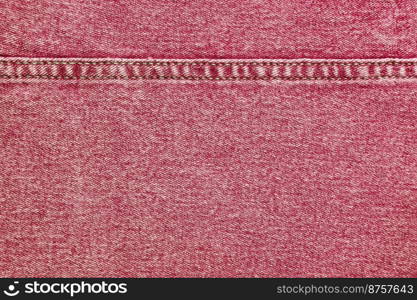 Denim jeans texture background. Texture of red colored cotton fabric with decorative seam. Stiched texture jean background. Fiber and fabric structurel. Wallpaper, banner, backdrop, header