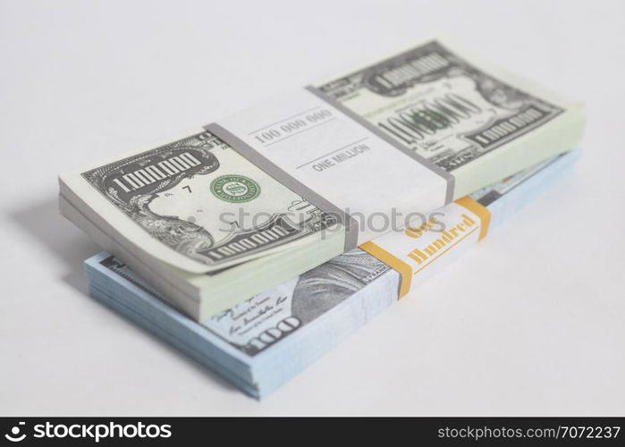 Denomination in one million dollars bills with tape isolated on white background. Denomination in one million and one hundred dollars bills with tape