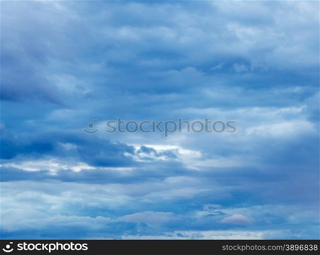 dense blue overcast in summer evening sky