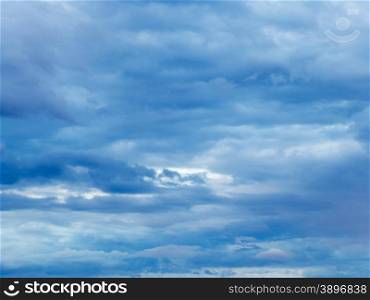 dense blue overcast in summer evening sky