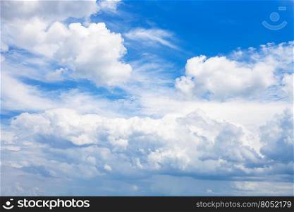 dense white clouds in blue sky in summer day, Kuban, Russia