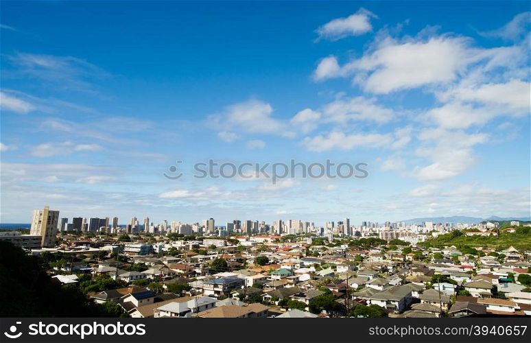 Densely situated homes and buildings exist in Honolulu on the island of Oahu