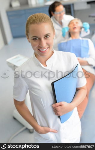 Dental assistant dentist checkup patient woman at professional clinic