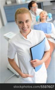 Dental assistant dentist checkup patient woman at professional clinic