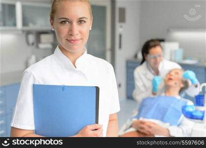 Dental assistant dentist checkup woman patient at stomatology clinic
