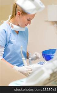 Dental assistant prepare equipment at modern stomatology clinic