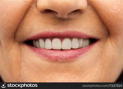 dental care and hygiene people concept - close up of senior woman smiling mouth and teeth. close up of senior woman smiling mouth and teeth