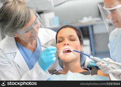 Dental check woman patient professional dentist team open mouth