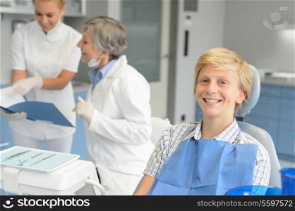 Dental checkup teenage patient boy and dentist nurse at stomatology clinic