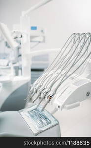 Dental equipment in dentistry clinic, stomatology cabinet interior, nobody. Dentist tools, orthodontist workplace