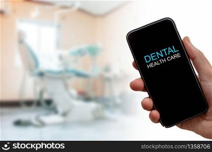 dental health care concept, Smart phone on blur dental clinic
