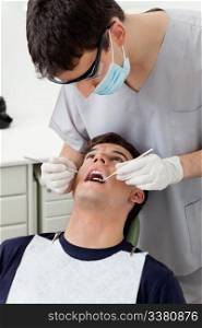 Dental hygienist working on patient&rsquo;s teeth