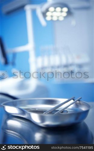 Dental instruments in the foreground