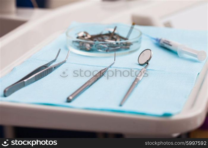 Dental instruments probe, tweezer, syringe and dental mirror for test the oral cavity