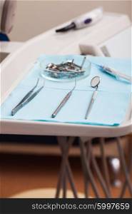 Dental instruments probe, tweezer, syringe and dental mirror for test the oral cavity