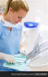 Dental nurse prepare professional medical tools at stomatology laboratory