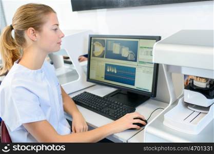 Dental nurse using computer