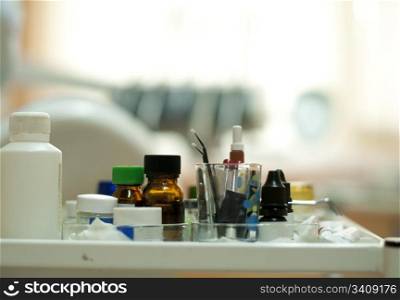 Dental supplies and equipment blurred on background