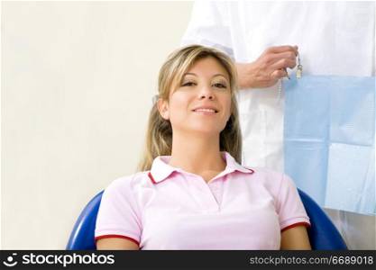 dentist and his patient in examination room. Copy space
