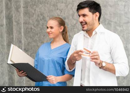 Dentist and nurse assistant working in dental office at the hospital. Dentistry concept.