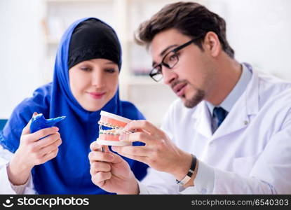 Dentist doctor and assistant working on new tooth implant