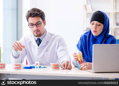 Dentist doctor and assistant working on new tooth implant