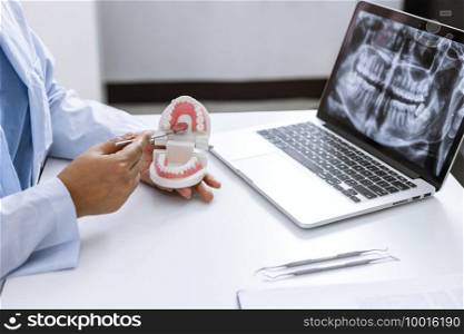 Dentist examining a patient teeth medical treatment at dental clinic
