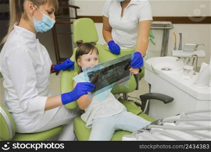 dentist girl patient looking radiography