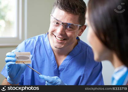 Dentist Giving Woman Advice On Cosmetic Teeth Whitening