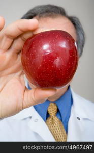 Dentist holding apple