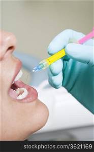 Dentist inspecting patient&acute;s teeth