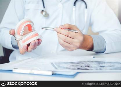 Dentist learning how to brush teeth