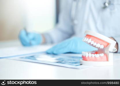 Dentist learning how to brush teeth