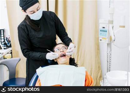 Dentist performing dental checkup, Patient checked by dentist, close up of dentist with patient, dentist performing root canal treatment on patient