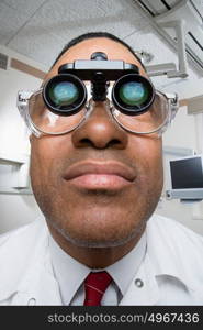 Dentist wearing dental binocular loupes