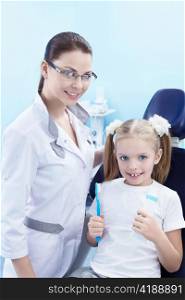 Dentist with a child in the dental clinic