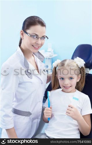 Dentist with a child in the dental clinic