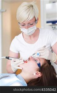 Dentist working on patients teeth
