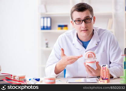 Dentist working teeth implant in medical lab