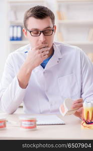 Dentist working teeth implant in medical lab