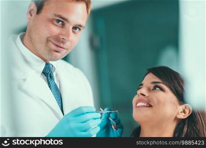Dentist Working with Young Female Patient