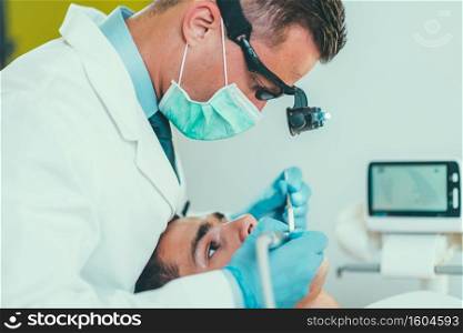 Dentist Working with Young Man