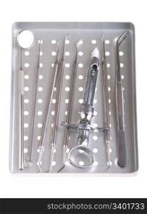 dentistry kit in a metal tray (surgery instruments and syringe) isolated on white background